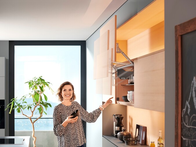KUHNLE_KNOEDLER FOTODESIGN blum lift up cabinet in thrissur, kerala